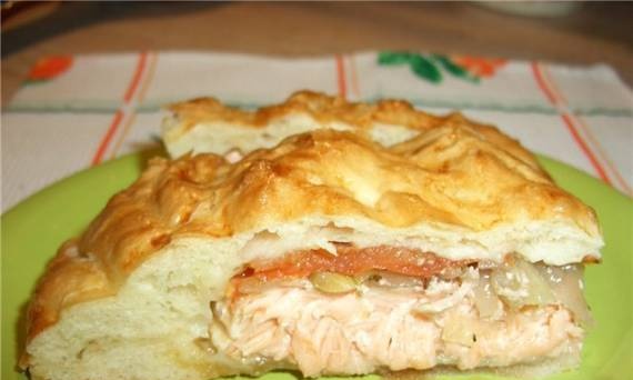 Salmon with onions and tomatoes in dough