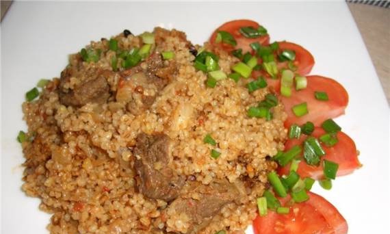 "Pilaf" from barley grits with tomatoes