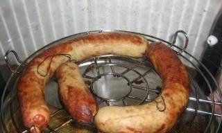 Smoked sausages in a smokehouse Unit 1210