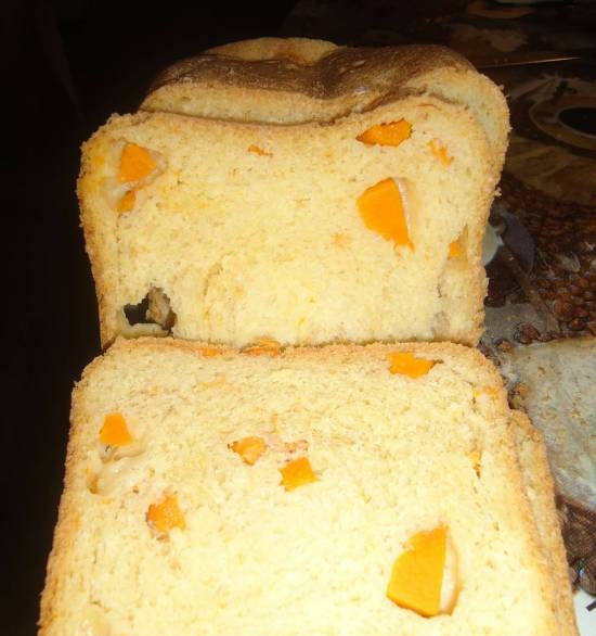 Pumpkin bread with pumpkin slices in a bread maker