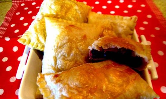 Puff pastries with frozen cherries in the oven