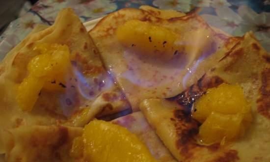 Flambéed honey pancakes with clementines
