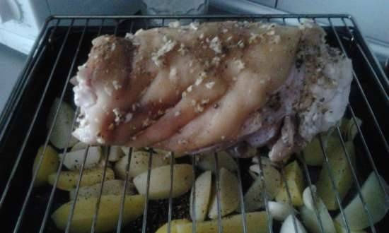 Oven baked pork knuckle with potatoes