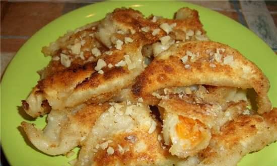Dumplings with apricots fried in sweet breadcrumbs