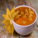 Semolina porridge on carrot juice with persimmon