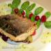 Char on a pillow of basil and caramelized berries with green creamy sauce