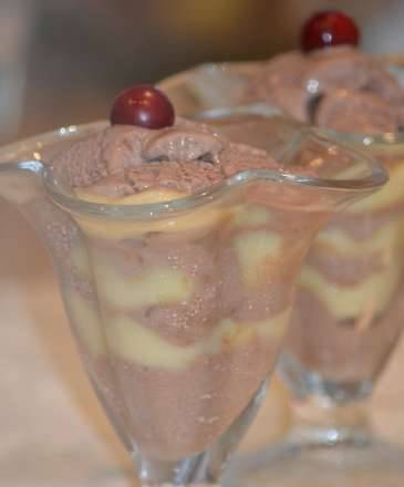 Profiteroles with chocolate ice cream on vanilla cream - the impeccable taste of French classics