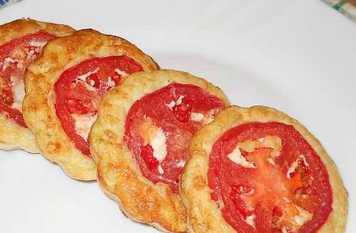 Curd zucchini medals with tomato