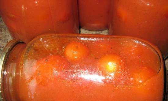 Pickled tomatoes in their own juice with aromatic herbs
