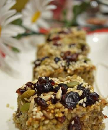 Multigrain (energy) squares from quinoa with coconut and cranberries, oven baked