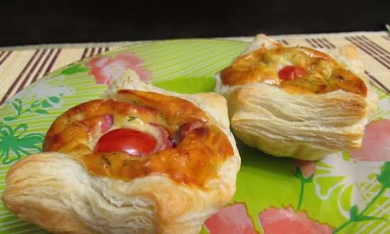 Puffs of ready-made dough with juicy cheese and sausage filling