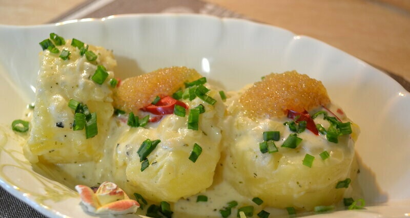 Steamed potatoes in a creamy coconut milk sauce