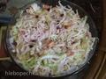 Light salad with crab sticks, pineapple and pomegranate