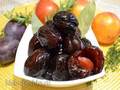 Spicy prunes candied fruits glace fruits, with rosemary, thyme