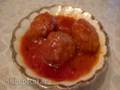 Meatballs in sweet and sour sauce with cheese