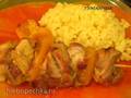 Chicken skewers in tangerine sauce with rice