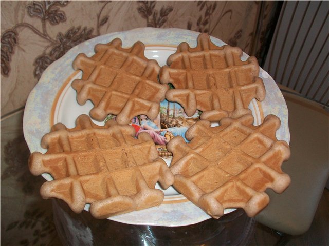 Chocolate shortbread cookies in a waffle iron