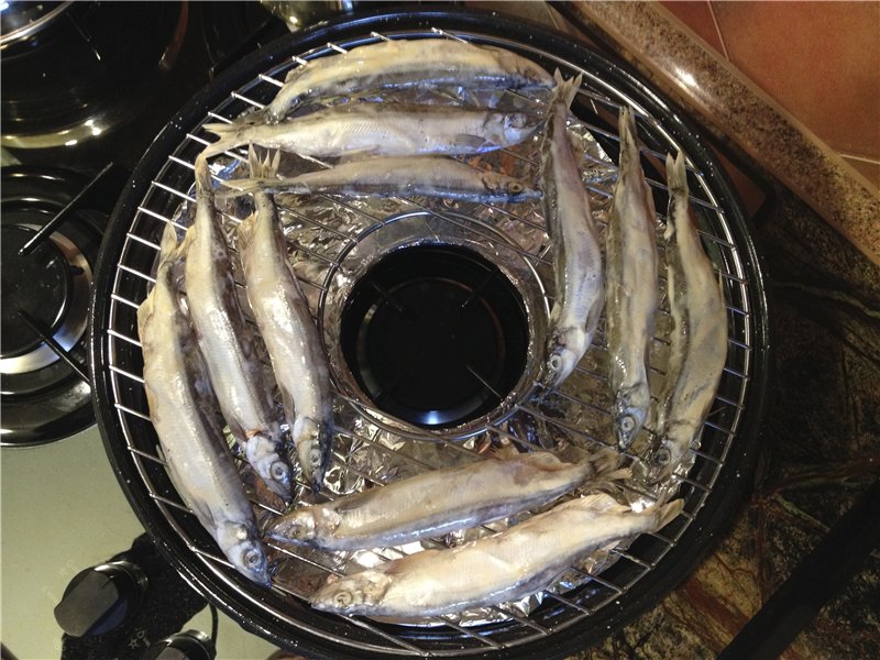 Capelin in a frying pan Grill gas
