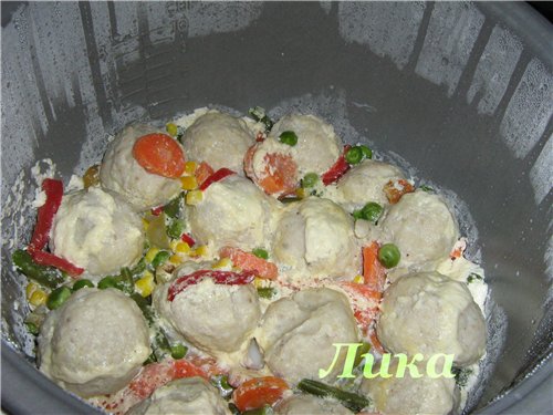 Fish meatballs with vegetables in a slow cooker