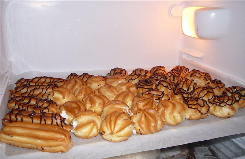 Eclairs and profiteroles with custard, whipped cream and Philadelphia cheese