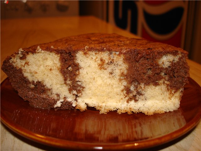 Tres leches cake with chocolate syrup