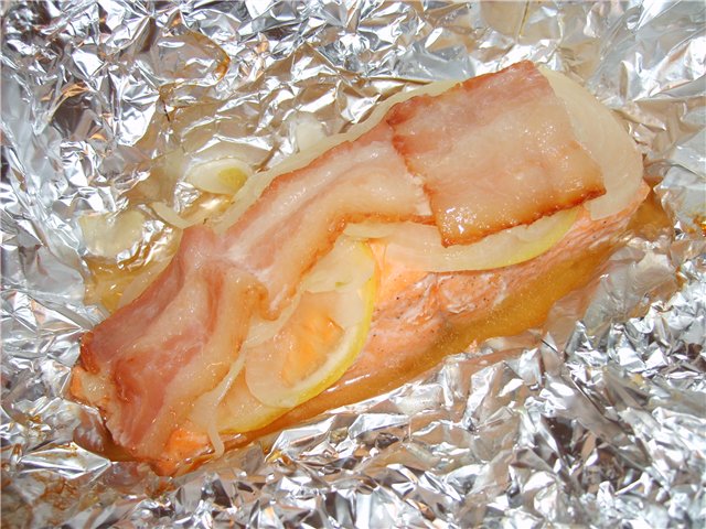 Red fish with bacon baked in foil.