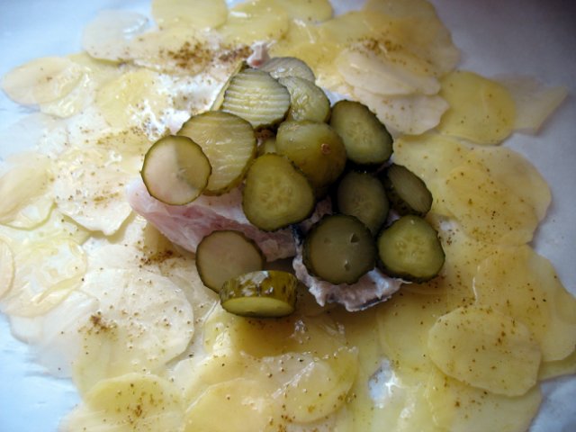 Fish with potatoes and pickles in a bag