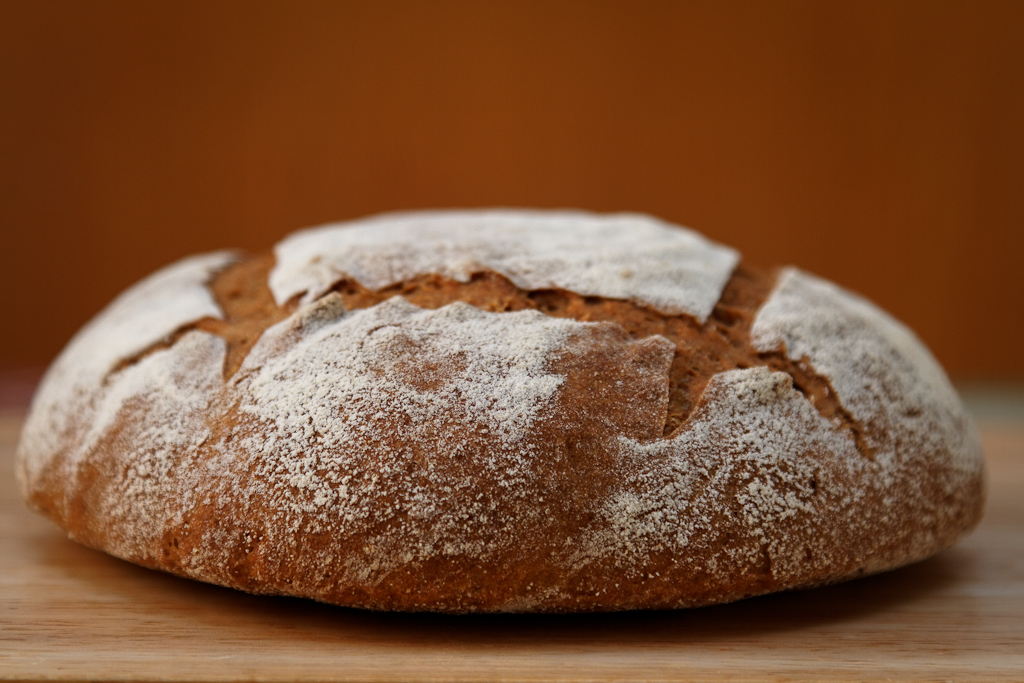 Dark rye-wheat bread on a big bag (oven)