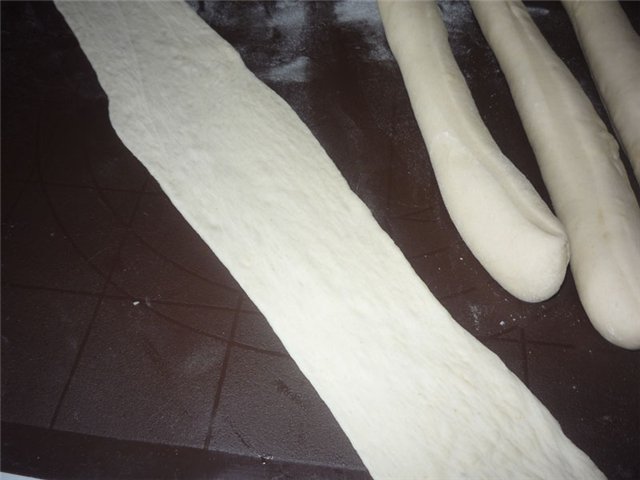 Arrows with caraway seeds on a thick dough