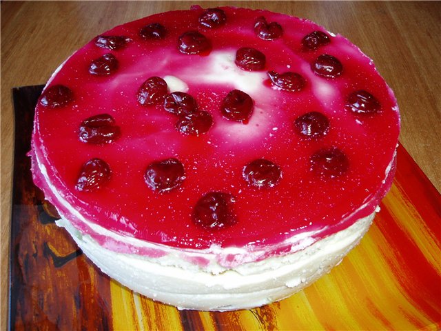 Chocolate cake with milk and cherry jelly