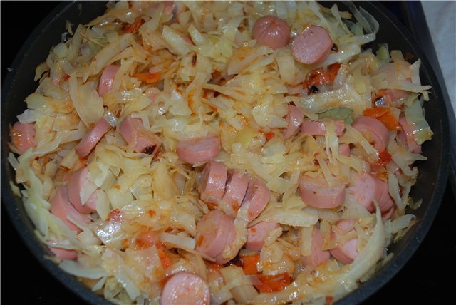 Solyanka (stewed cabbage) with sausages