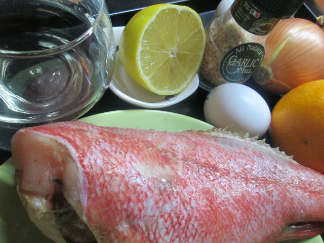 Pesce persico in salsa d'arancia con basilico