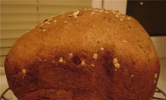 Bread with garlic, walnuts, basil and oregano in a bread maker