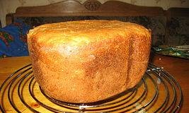 Wheat-rye bread with cereals and seeds, onions and cheese in a bread maker