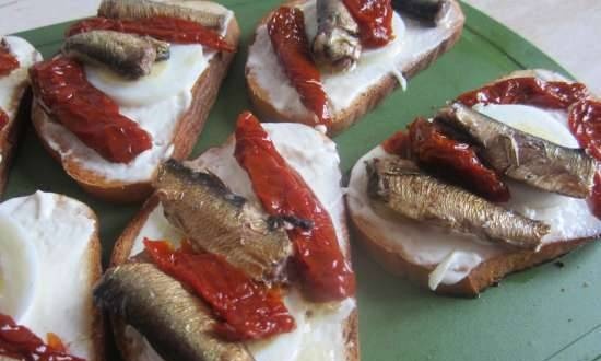 Sandwiches with sprats and sun-dried tomatoes