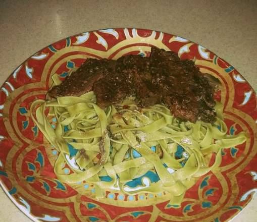 Oven stewed beef with tomatoes in its own juice