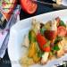 Tomato salad with crispy bread and avocado