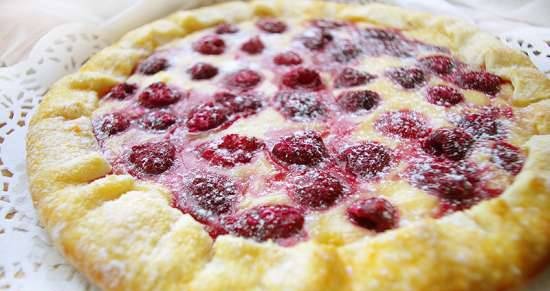 Biscuit with custard and raspberries