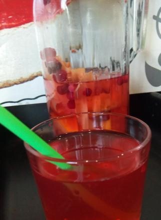 Hot cranberry-based fruit and berry drink