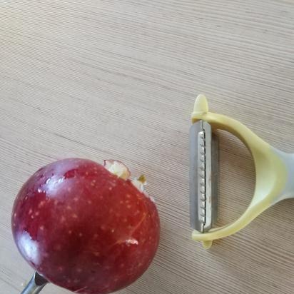 Peeling an apple peel with an electric drill