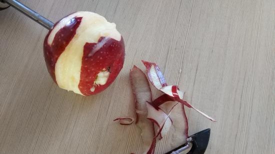 Peeling an apple peel with an electric drill