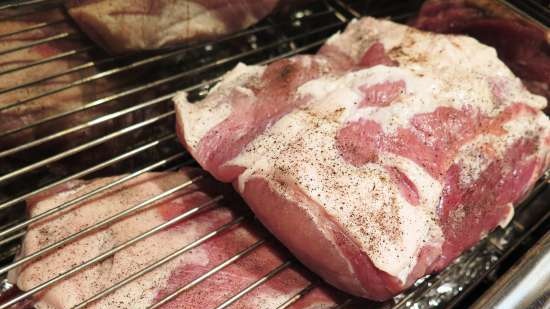 Smoked pork neck in a smokehouse with a water seal