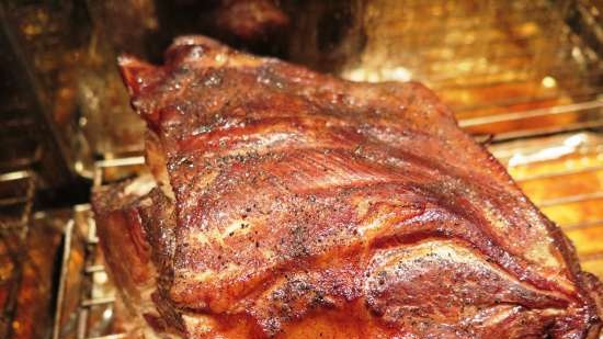 Smoked pork neck in a smokehouse with a water seal