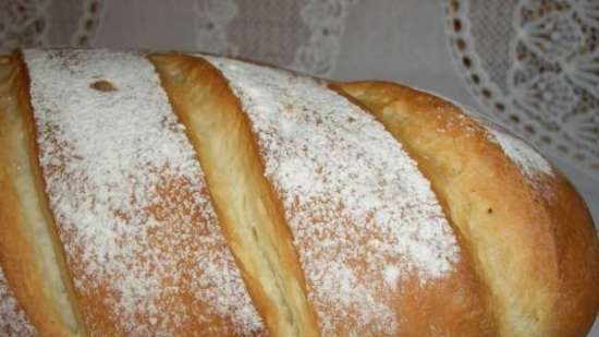 Wheat bread with soft cheese and white wine in the oven