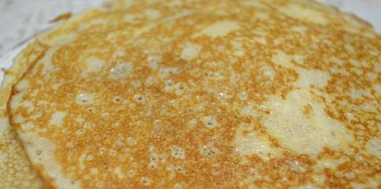 Milk pancakes, butter, on dough from old multigrain dough