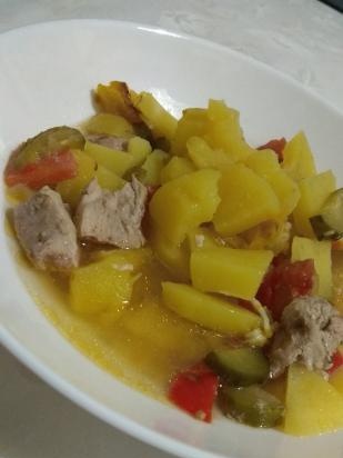 Pot of meat and vegetables with broth