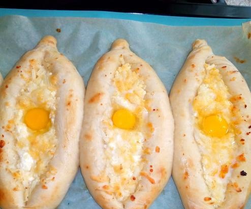 Khachapuri boats with curd and cheese filling