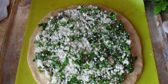 Octopus pie with whole grain flour, cottage cheese and herbs