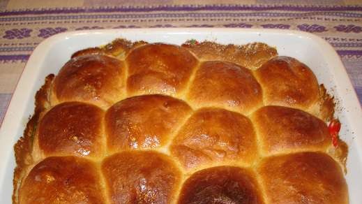 Pumpkin buns with apple and raisins in a creamy filling