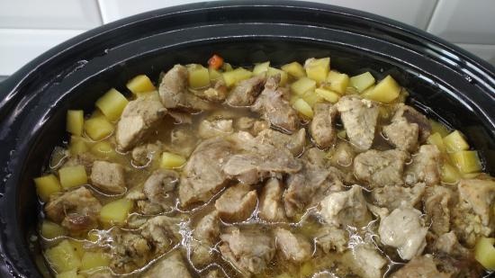 Pot of meat and vegetables with broth